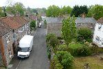 A terrace of stone cottages taken from a high vantag