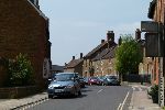 Street scene with terraces of older brown-sandstone properties